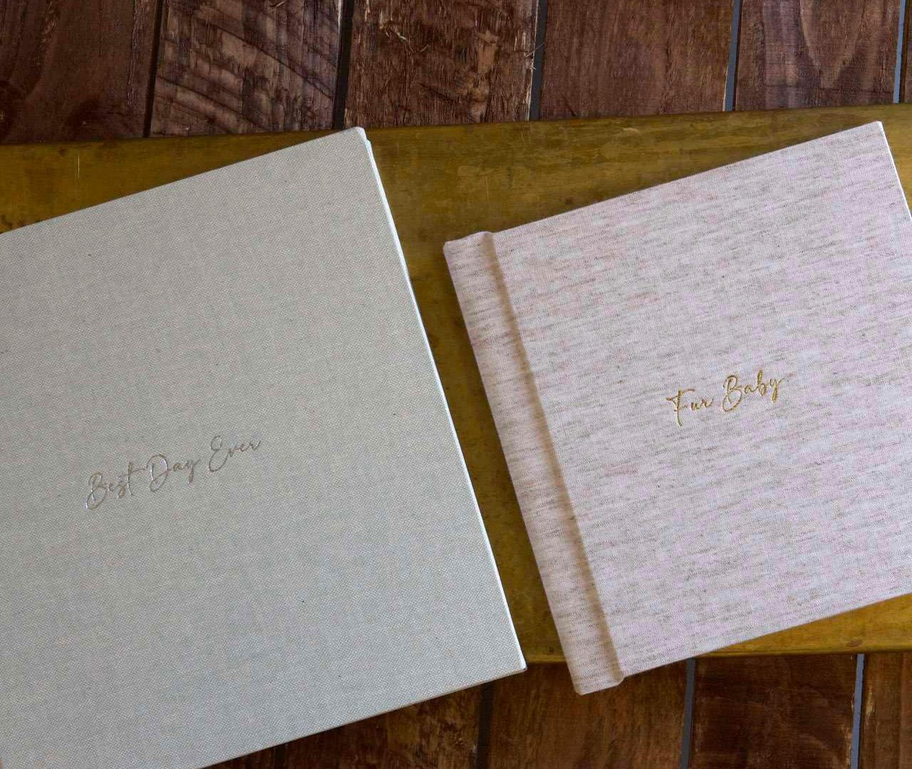 Two budget friendly photo albums next to each other 10x10 and 8x8