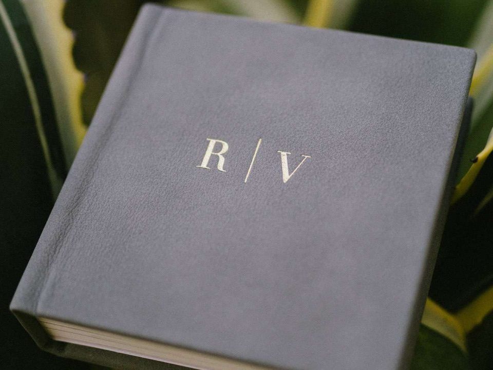 A small square photo book personalised with a custom design