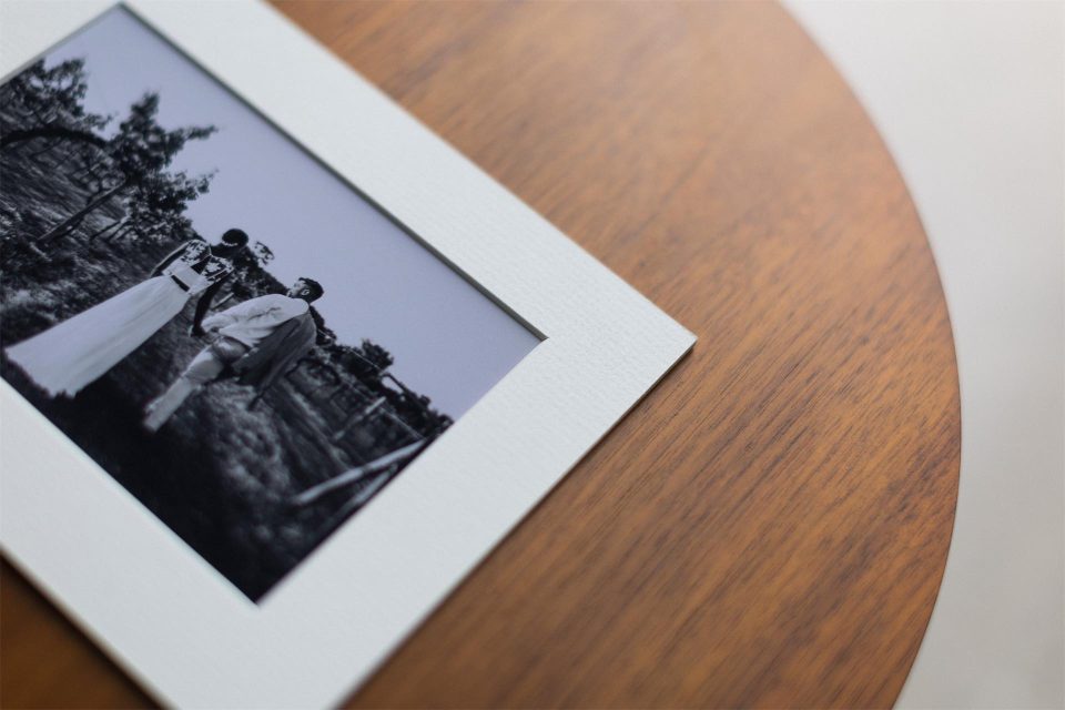 A detail shot of a Folio matted print mounted in archival mount board with a bevel cut aperture with fine art printing