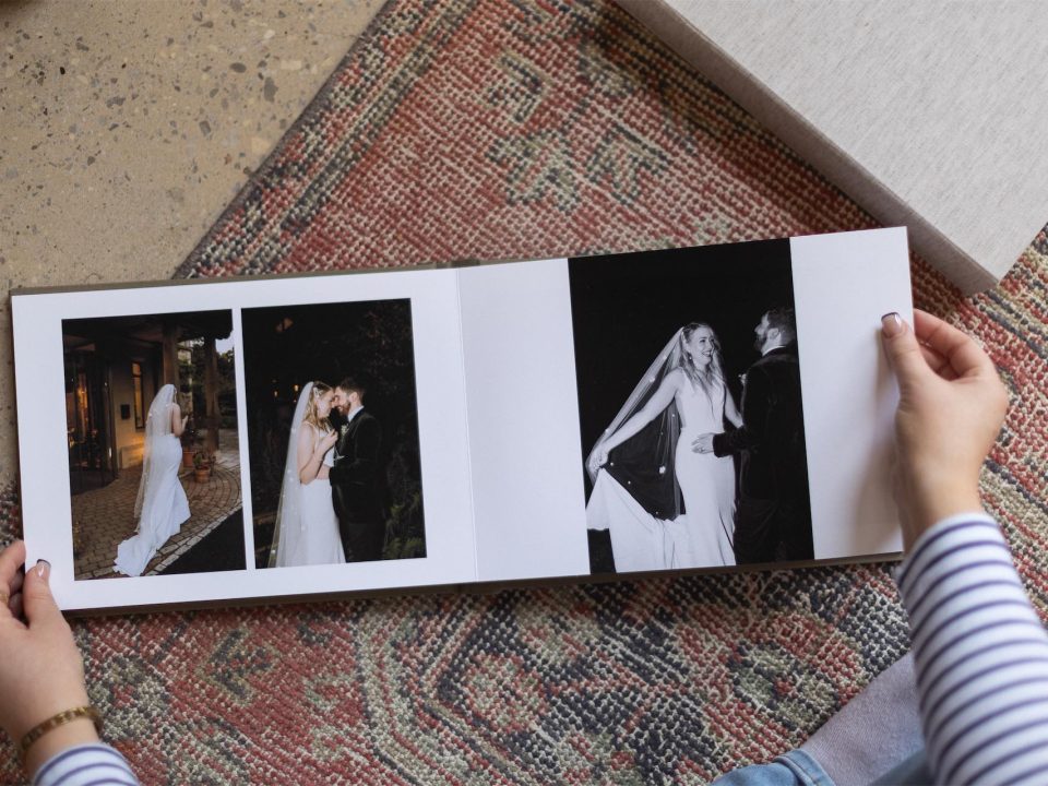 A wedding book on a rug viewed from above
