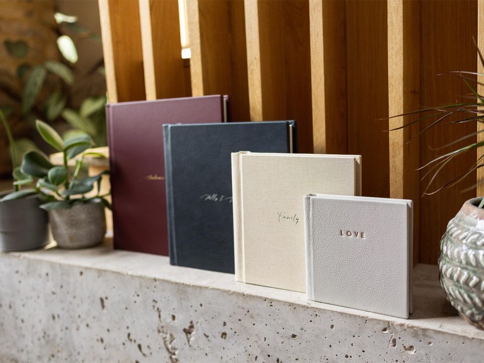 A collection of UK supplied luxury photo albums on a shelf