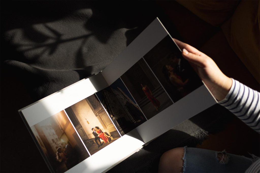 woman flipping through a wedding album for album campaign Instagram content 