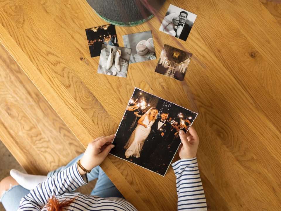 a woman holding fine art printing wedding images