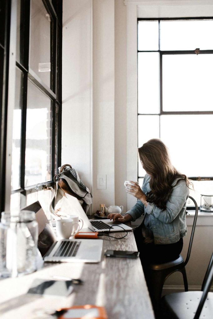 Woman working at laptop on desk