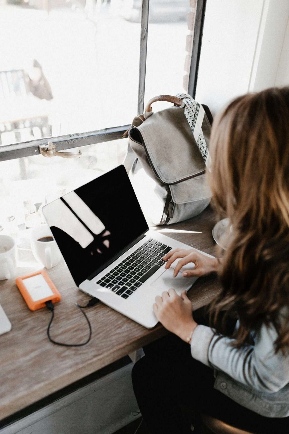 Close up of woman working on laptop