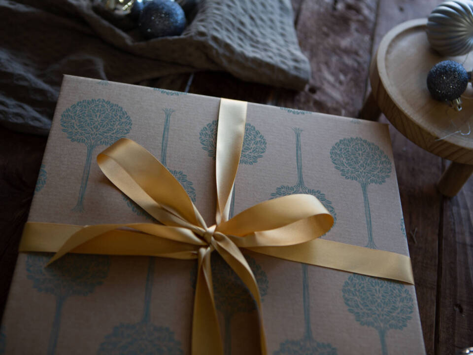 a Folio packaging box with gold ribbon