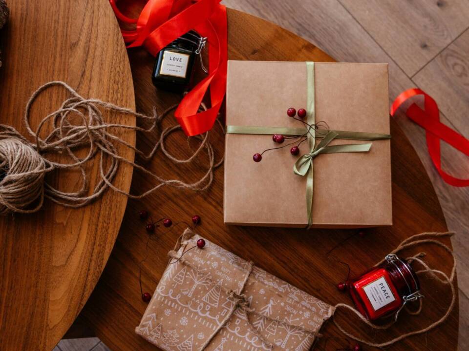 Christmas gifts wrapped up on a wooden table