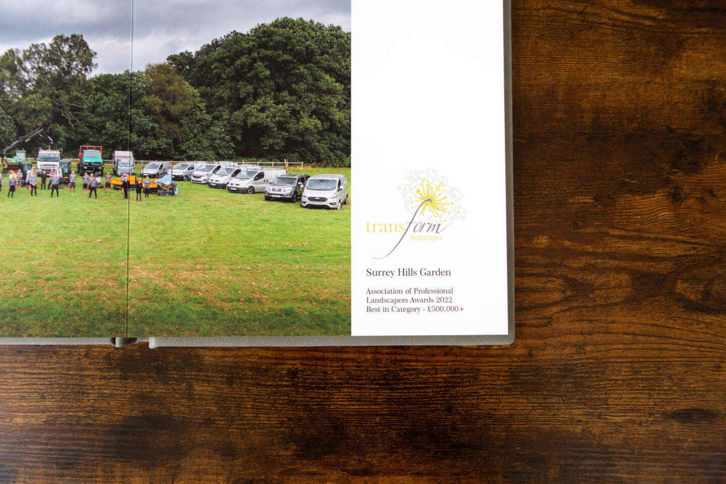 fine art album on wooden table showcasing landscaping business as a corporate gift for clients 