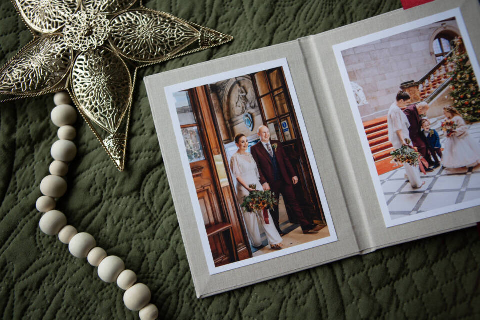 a print presentation with Christmas styling of wedding images