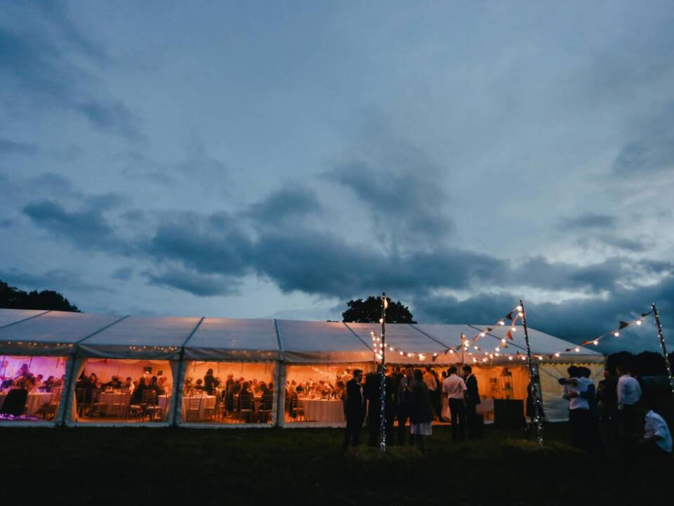 wedding venue tent at night with lights