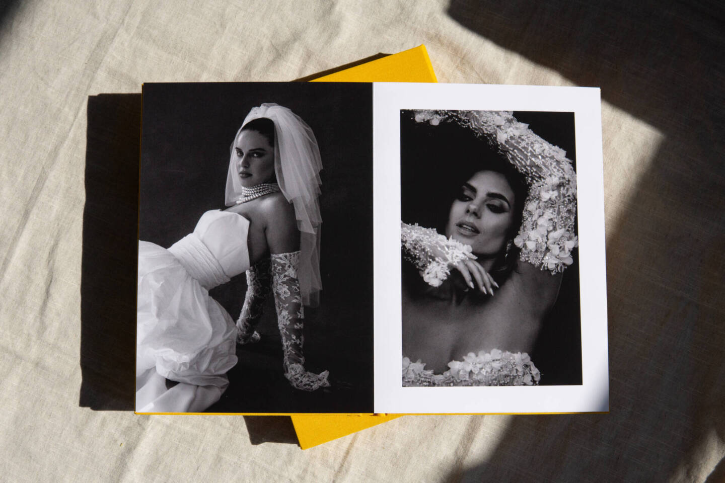 overhead shot of an open coffee table book with editorial style wedding images 